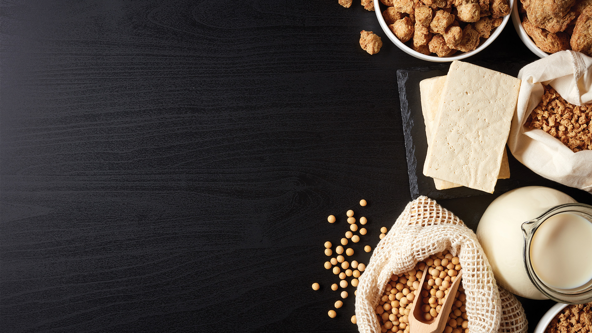 Soy foods on black background